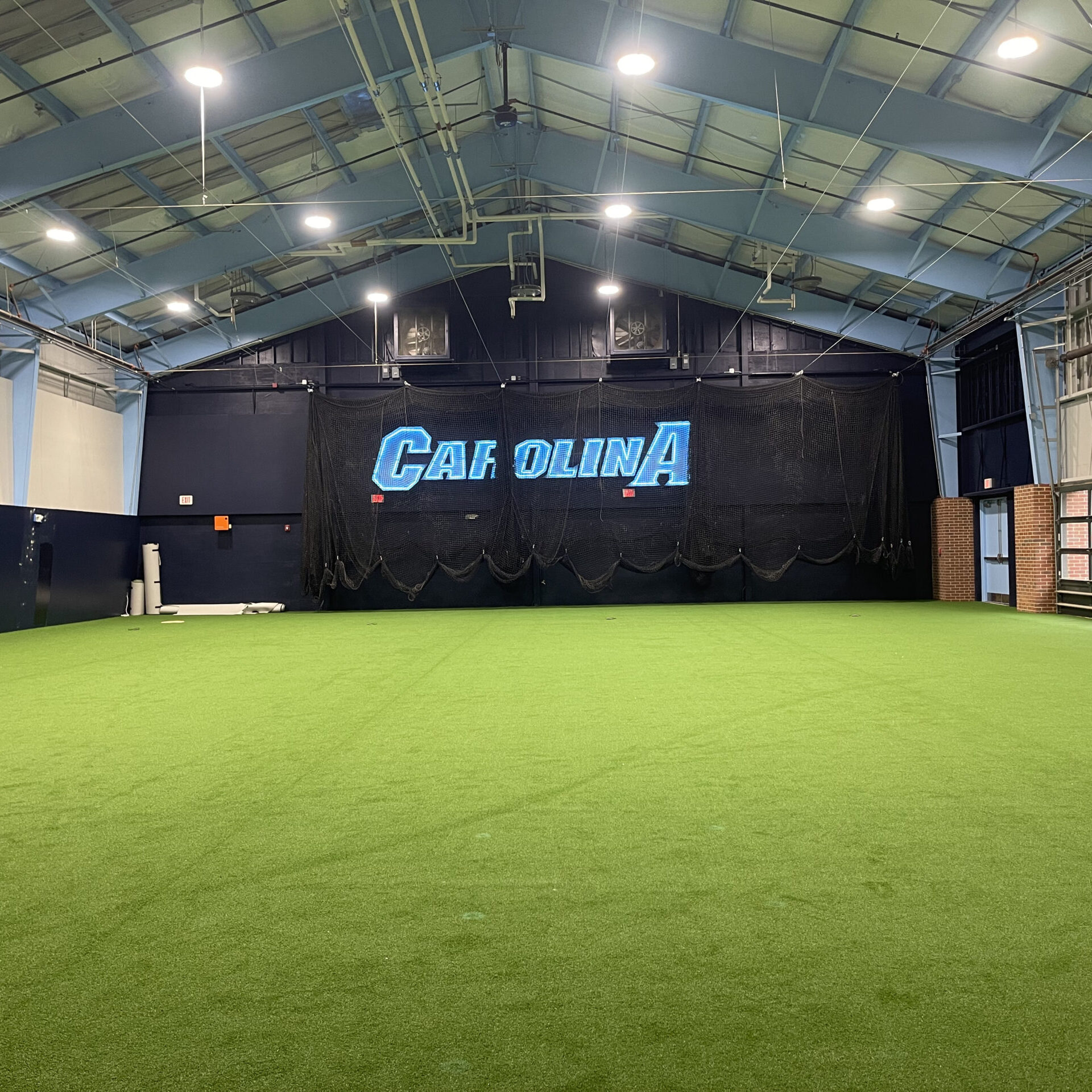 Before and After Pics at UNC Chapel Hill Indoor Hitting Facility - Artificial Turf by Carolina Sports Concepts